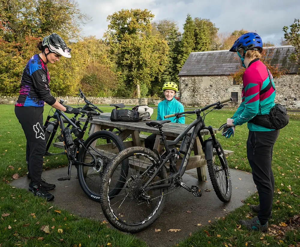 Group of three getting prepared for cycling Ballymahon Forest Trial